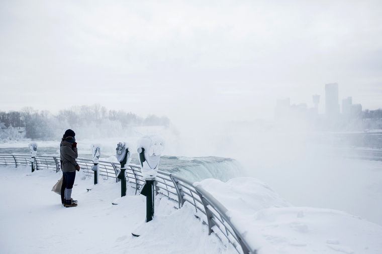 Image: Visitors view frozen Niagara Falls in Niagara Falls New York