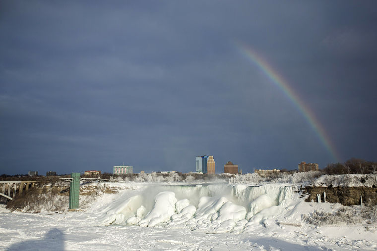 Image: A rainbow appears over the partially frozen American Falls in sub freezing temperatures in Niagara Falls Ontario